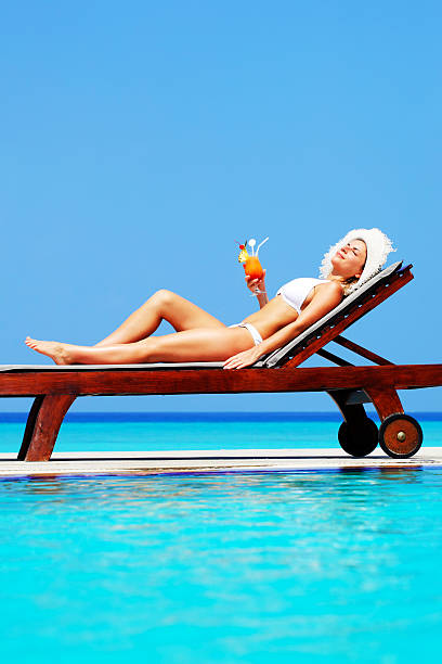 istock Young woman enjoying in cocktail. 185224090