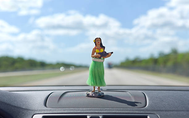 Dashboard hula dancer Dashboard hula dancer on car dashboard.Please Also See: dashboard vehicle part photos stock pictures, royalty-free photos & images
