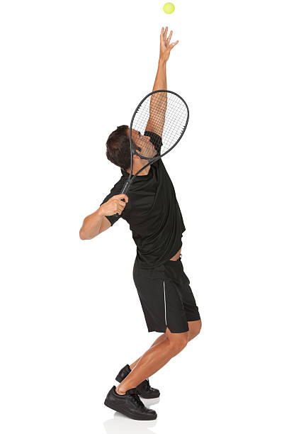 giocatore di tennis in azione - tennis men indoors serving foto e immagini stock