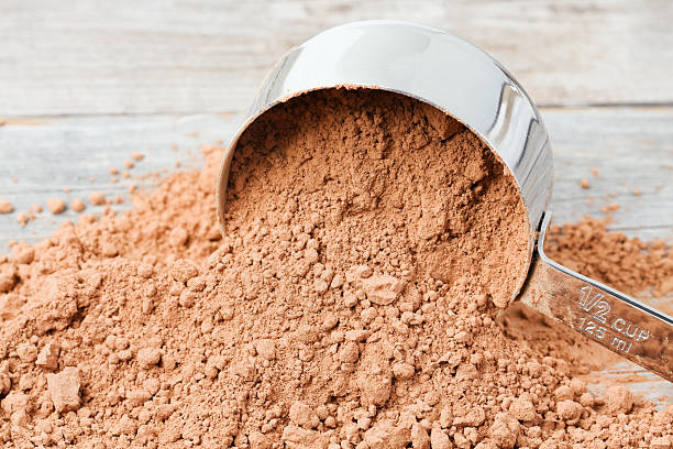 istock Measuring Cup with Spilled Cocoa Powder 185224807