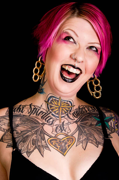 istock Pink haired tattooed woman making a face. 185224825