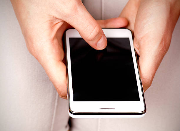 istock Woman hands holding smartphone with blackk screen 185224954