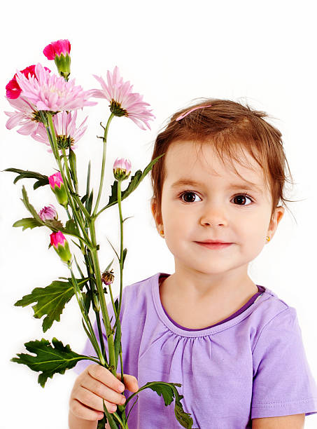 istock Cute little girl with flowers 185225420