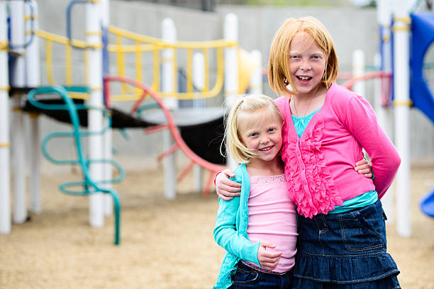 istock Happy Little Girls On Playground 185225497
