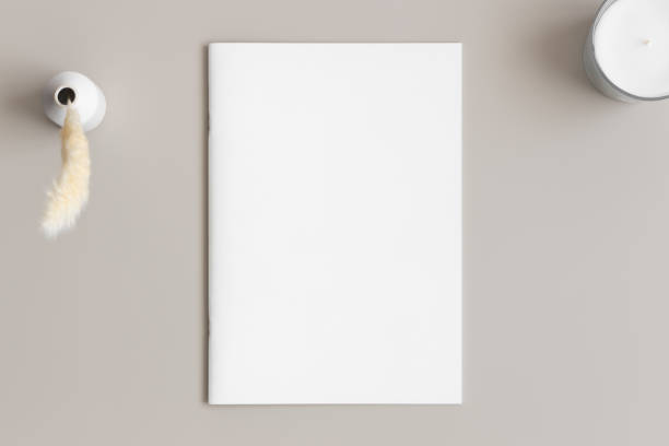 istock Magazine mockup with a pampas and a candle on the beige table. 1852256102