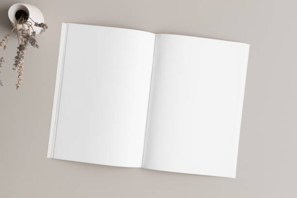 Open magazine mockup with a lavender on the beige table.