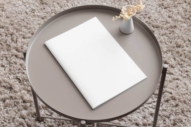 istock Magazine mockup with a gypsophila on the beige table. 1852256119