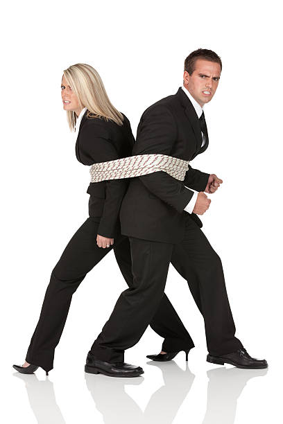 ビジネスのカップルにロープの紐 - problems shoe grimacing high heels ストックフォトと画像