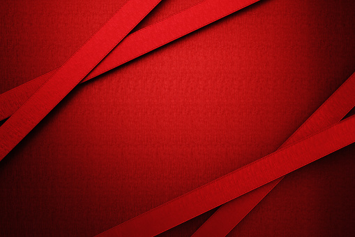 Red ribbons on red background. Horizontal composition.