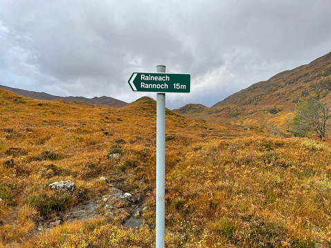 Sign marking a footpath towards Rannoch at Corrour in the Highlands of Scotland - photographed on a mobile phone