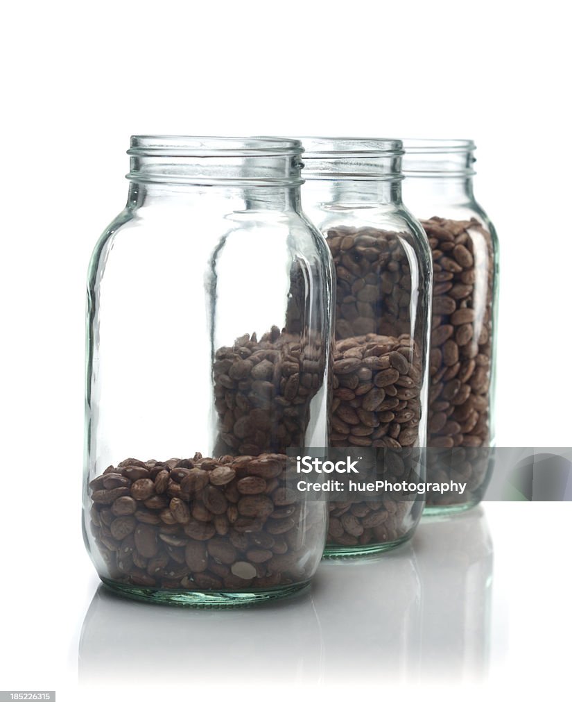 Jars of beans Isolated on white concept shot about rising food costs. Three jars of beans progressively fuller. Bar Graph Stock Photo