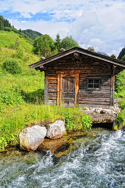 istock HDR of Barn in alpine Tirol river landscape (Austria) 185226358