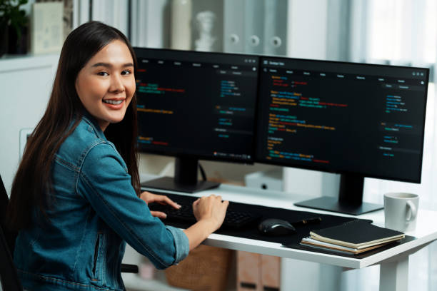 istock Young Asian in IT developer looking at camera to present on pc. Stratagem. 1852265696