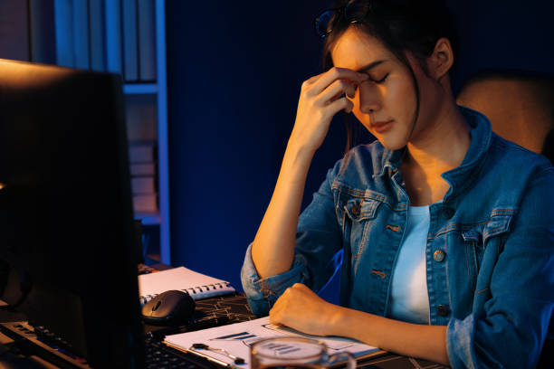 istock Stressful asian creative looking on pc to search project creator. Stratagem. 1852267978