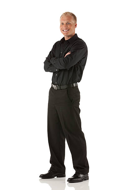 istock Happy businessman standing with his arms crossed 185226843