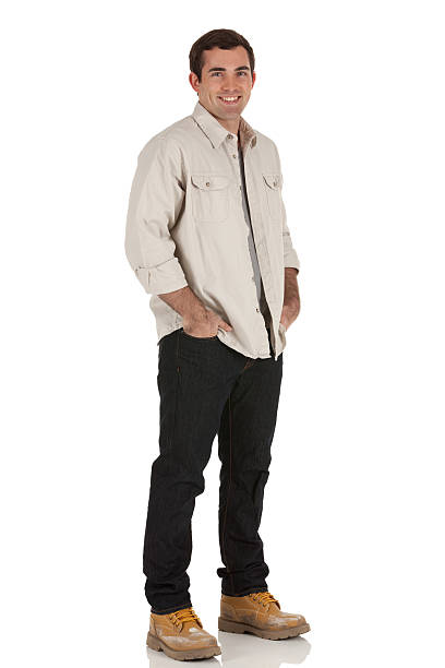 istock Happy man standing with his hands in pockets 185226900