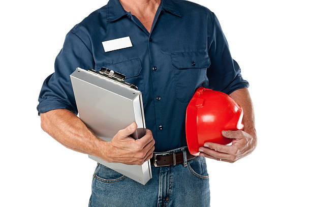 riparatore in uniforme - clipboard men sales occupation maintenance engineer foto e immagini stock