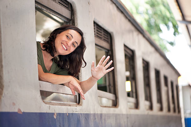 Woman Train Passenger Waving stock photo