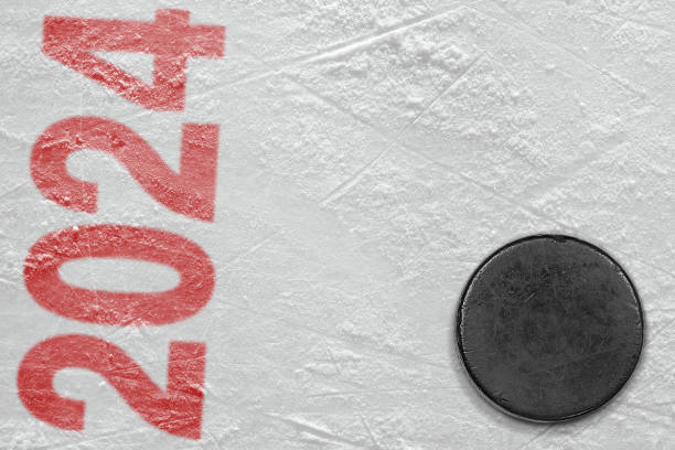 istock Hockey puck on ice arena 1852276893