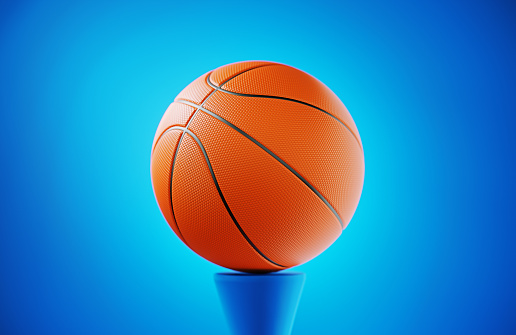 Basketball ball on blue background. Horizontal composition.
