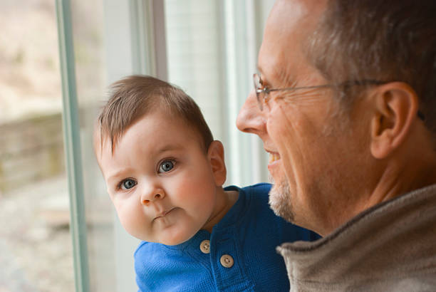 Baby and Grandpa stock photo