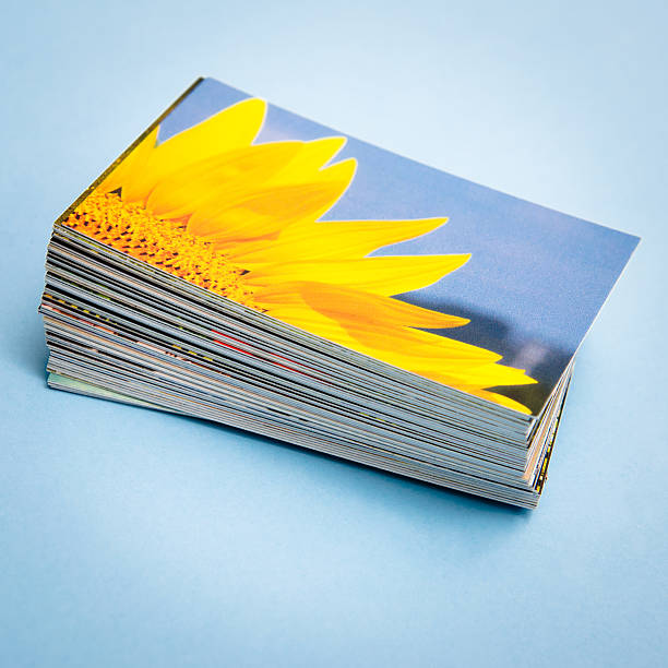 Stack of printed colorful images about spring sunflower