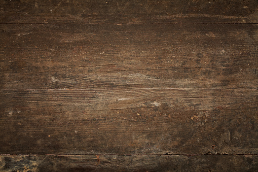 Overhead view of old dark brown wooden table