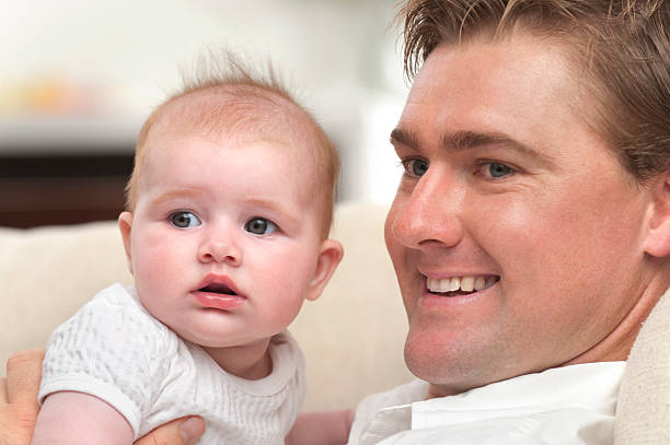 istock Loving father holding his baby daughter 185228832