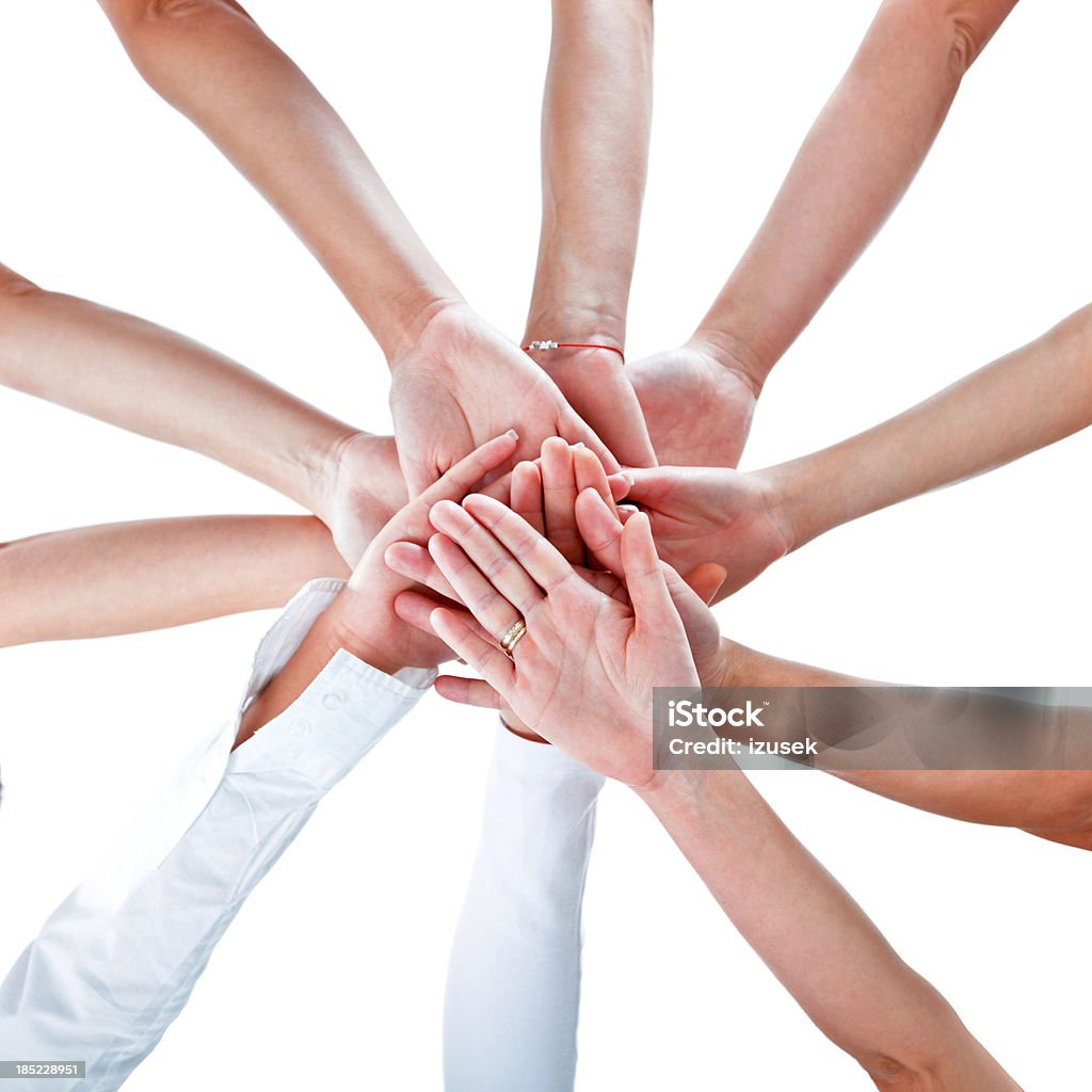 Solidarity Teamwork concept. 10 hands of women joining together. Elevated view, white background. Only Women Stock Photo