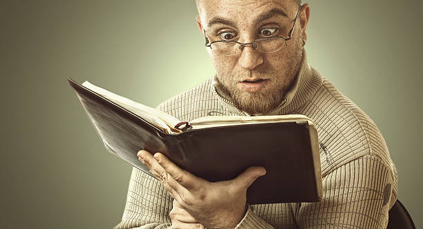 istock Confused man who reads books 185229187