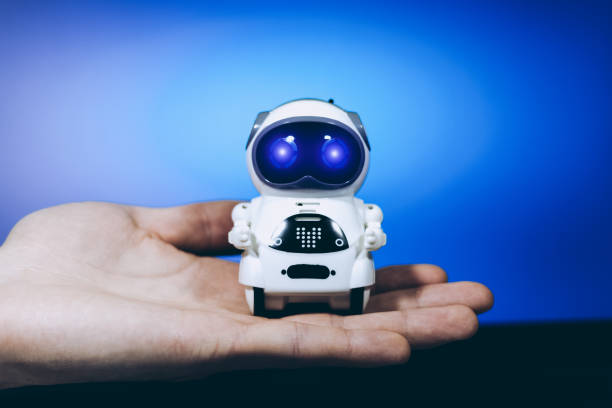 istock Real small Robot on man's hand. App for business development. 1852294050