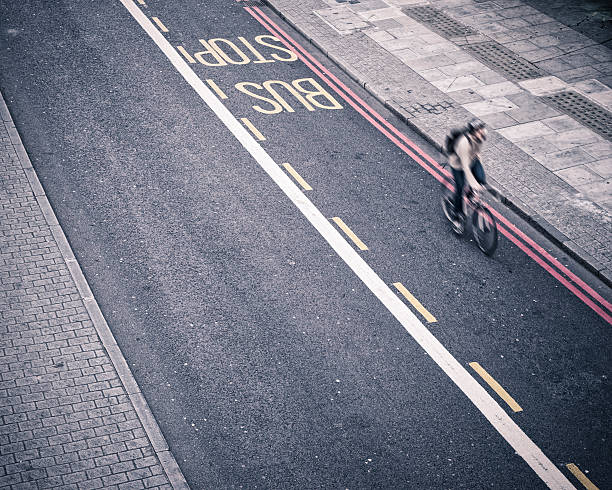 Man rides a bicycle in London. little of grain added for the mood.View my lightbox: