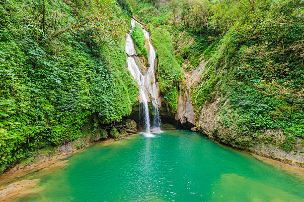 Few kilometers west of Trinidad a road climbs into the Sierra del Escambray and reaches the Gran Parque Natural Topes de Collantes, a protected area with ferns, bamboo, eucalyptus and lots of footpaths created to discover this paradise of nature. Some of these paths lead to wonderful waterfalls like this one called Salto de Vegas Grandes and its fantastic natural swimming pool. Sancti Spiritus Province, Cuba. Canon EOS 5D