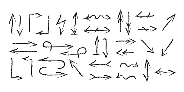 A set of different charcoal arrows pointing in different directions.
Doodle vector illustrati
