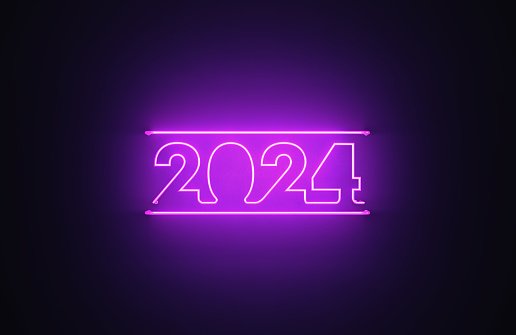 Purple neon light writes 2024 on black background. Horizontal composition with copy space.