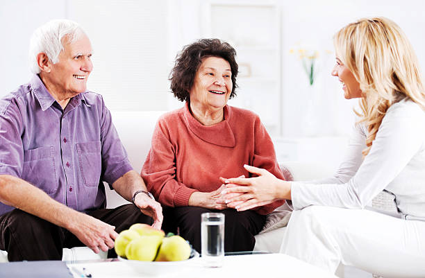 istock Daughter talking to her elderly parents. 185229890
