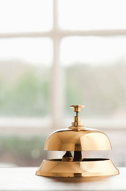 звонок портье на стол у окна с местом для копии - service bell bell customer service стоковые фото и изображения