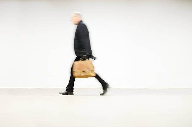 Motion blurred man walking away from subway.More railroad/subway pictures below