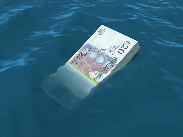 istock Money sinking in water 185230669