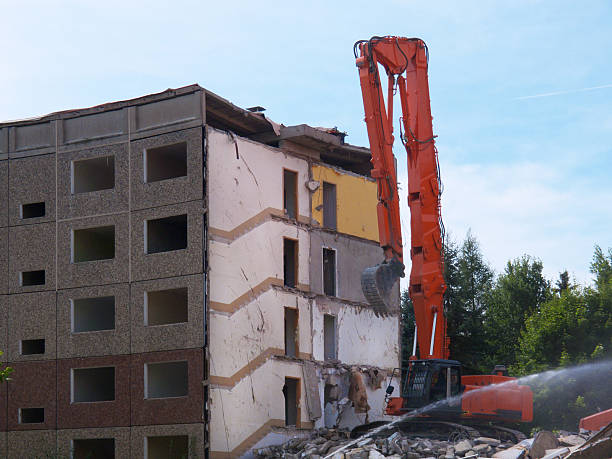 istock Digger demolishing a living house - GDR style 185230929