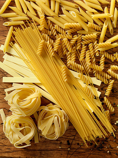 pasta - pasta directly above fusilli food stock-fotos und bilder