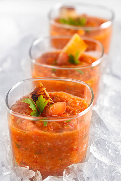 istock Three glass cups of tomato puree lined up artistically 185231160