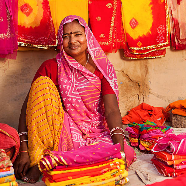 istock Woman selling colorful fabrics 185231177