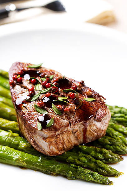istock Beef fillet with pink pepper and asparagus 185231198
