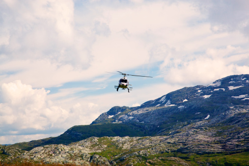 Helikopter coming in to land over Norwegian mountains. Hardanger.See also my LB: