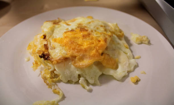istock Close-up of the fried eggs on the white plate. 1852314845