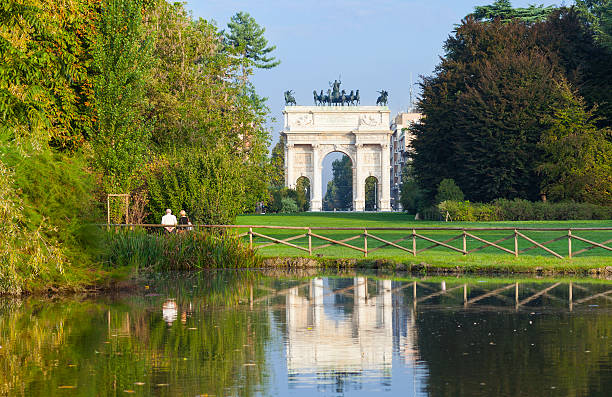Milan Italy Parco Sempione with the Porta Sempione Parco Sempione with the Porta Sempione. Parco Sempione is the largest and most important city park in the centre of Milan. triumphal arch photos stock pictures, royalty-free photos & images