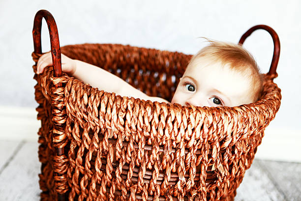 Baby Peeking Out From Basket