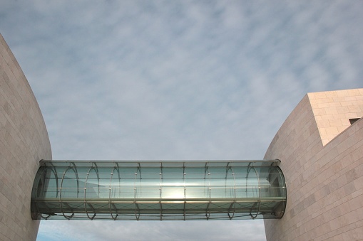 Elevated glass walkway connecting buildings at the Fundação Champalimaud in Belem, Lisbon.