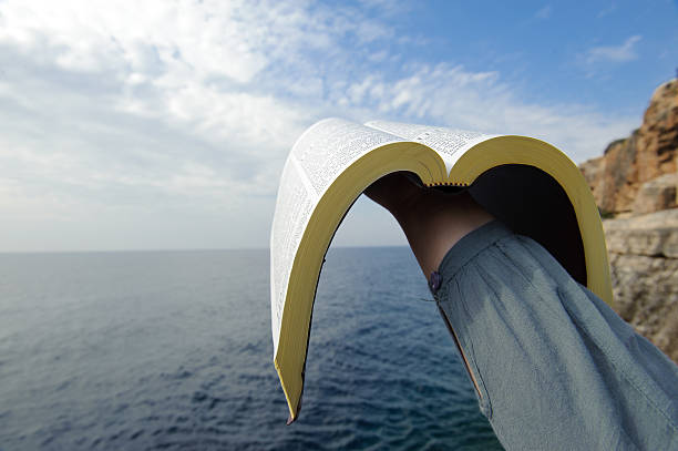 istock Bible raised to heaven 185231643